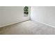 Carpeted bedroom featuring natural light with a view to outside at 10429 Avelar Ridge Dr, Riverview, FL 33578