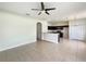 Open-concept living room flows into kitchen featuring tile floors, creating an inviting space at 10429 Avelar Ridge Dr, Riverview, FL 33578