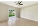 Bright room featuring sliding glass doors leading to a green backyard at 10429 Avelar Ridge Dr, Riverview, FL 33578