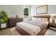 Inviting main bedroom with a large window, stylish furniture, and a cozy rug at 10429 Avelar Ridge Dr, Riverview, FL 33578