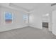 Spacious bedroom featuring two windows, neutral walls and carpet, and a large closet at 17322 Alderwood Ln, Punta Gorda, FL 33982
