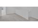 Upstairs landing area with neutral walls and plush carpet at 17322 Alderwood Ln, Punta Gorda, FL 33982