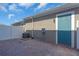 Charming brick patio with a teal back door and white fence, perfect for relaxing outdoors at 17322 Alderwood Ln, Punta Gorda, FL 33982