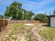 Expansive backyard with privacy fence and ample space for outdoor activities on a sunny day at 5001 S 88Th St, Tampa, FL 33619