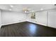 Serene bedroom with stylish wood flooring, a ceiling fan, fresh paint, and a view to backyard at 5001 S 88Th St, Tampa, FL 33619