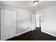 Bedroom features hardwood floors, white walls, and closet at 5001 S 88Th St, Tampa, FL 33619