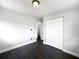A minimalist bedroom features a closet, hardwood floors, and neutral palette, creating a clean, simple aesthetic at 5001 S 88Th St, Tampa, FL 33619