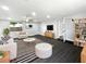 Bright and airy living room with recessed lighting, wood-look floors, and a neutral color palette at 5001 S 88Th St, Tampa, FL 33619