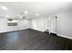 Bright, open living room with sleek, dark floors and recessed lighting, creating a modern and inviting space at 5001 S 88Th St, Tampa, FL 33619