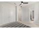 Bedroom featuring carpet, closet, and bathroom access for convenience and privacy at 8297 Ivy Stark Blvd, Wesley Chapel, FL 33545