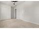 Bedroom with neutral carpet features a ceiling fan and bright white trim at 8297 Ivy Stark Blvd, Wesley Chapel, FL 33545