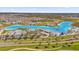 Experience resort-style living with sandy beaches, clear blue water, and vibrant community amenities at 8297 Ivy Stark Blvd, Wesley Chapel, FL 33545