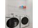 Laundry room featuring new front-load washer and dryer at 8297 Ivy Stark Blvd, Wesley Chapel, FL 33545