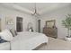 Spacious main bedroom featuring tray ceilings and large windows at 8297 Ivy Stark Blvd, Wesley Chapel, FL 33545