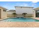 Backyard pool with brick trim, water feature, and palm trees providing a serene outdoor space at 8297 Ivy Stark Blvd, Wesley Chapel, FL 33545
