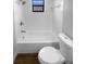 Bathroom featuring a tub shower, and wood flooring at 12800 Kellywood Cir, Hudson, FL 34669