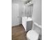 Bathroom featuring a new vanity, modern fixtures, and wood flooring at 12800 Kellywood Cir, Hudson, FL 34669