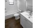 Bathroom featuring a tub/shower, vanity, and wood flooring at 12800 Kellywood Cir, Hudson, FL 34669