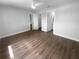 Bedroom with wood floors, neutral paint, two doors, and natural light at 12800 Kellywood Cir, Hudson, FL 34669