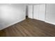 Bedroom with wood flooring, neutral walls, and closet at 12800 Kellywood Cir, Hudson, FL 34669