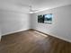 Empty bedroom with wood flooring, window, and neutral paint at 12800 Kellywood Cir, Hudson, FL 34669