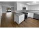 Modern kitchen with stainless steel appliances, granite countertops, and white cabinetry at 12800 Kellywood Cir, Hudson, FL 34669
