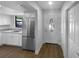 Eat-in kitchen featuring stainless steel appliances, granite countertops, and white cabinetry at 12800 Kellywood Cir, Hudson, FL 34669