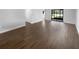 Spacious living room with wood flooring and sliding glass doors leading to the outside at 12800 Kellywood Cir, Hudson, FL 34669