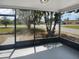 View from the enclosed sunroom of the front yard and street at 12800 Kellywood Cir, Hudson, FL 34669