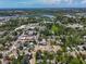 An aerial view showcases the town's layout, with its proximity to water, buildings, and greenery at 226 N Grosse Ave, Tarpon Springs, FL 34689