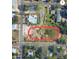 An aerial view of a vacant lot shows its proximity to nearby streets and residences, offering development potential at 226 N Grosse Ave, Tarpon Springs, FL 34689