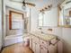 Bathroom with bathtub, toilet, and vanity needs renovation at 226 N Grosse Ave, Tarpon Springs, FL 34689