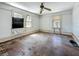 Bedroom with windows and hardwood floors, offering natural light and a classic foundation for personalized renovations at 226 N Grosse Ave, Tarpon Springs, FL 34689