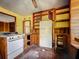 This kitchen features custom wood cabinetry, classic appliances, and an abundance of natural light at 226 N Grosse Ave, Tarpon Springs, FL 34689