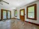 The living room showcases classic windows, hardwood floors, and original wood trim at 226 N Grosse Ave, Tarpon Springs, FL 34689