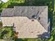 Birds-eye view of the roof with an interesting pattern, and surrounding garden at 5009 Clover Mist Dr, Apollo Beach, FL 33572
