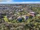 Expansive aerial view of a residential neighborhood with tree-lined streets and community lakes at 5009 Clover Mist Dr, Apollo Beach, FL 33572