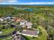 Aerial view of lovely homes nestled among lush greenery and tranquil lakes under a clear blue sky at 5009 Clover Mist Dr, Apollo Beach, FL 33572