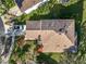 Birds-eye view of a home with a brown roof, surrounded by greenery, and a white truck at 5009 Clover Mist Dr, Apollo Beach, FL 33572