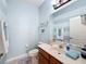 Bathroom featuring a tiled floor, single sink vanity and blue-striped walls at 5009 Clover Mist Dr, Apollo Beach, FL 33572