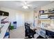 Bright bedroom with lots of desk space and a view of the outdoors at 5009 Clover Mist Dr, Apollo Beach, FL 33572