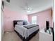 Cozy bedroom featuring a ceiling fan, plush carpet, and decoratively adorned table at 5009 Clover Mist Dr, Apollo Beach, FL 33572