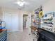 Versatile bedroom perfect for crafts, complete with storage, bright lighting, and closet at 5009 Clover Mist Dr, Apollo Beach, FL 33572