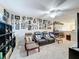 Second story bonus room with carpet floors, a ceiling fan, TV, wall decor and comfortable seating at 5009 Clover Mist Dr, Apollo Beach, FL 33572
