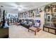 Bonus room with wall décor, a ceiling fan, carpet flooring, and three leather recliners for ultimate comfort at 5009 Clover Mist Dr, Apollo Beach, FL 33572