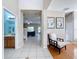 Open foyer featuring neutral tile, and views into the bathroom and living room at 5009 Clover Mist Dr, Apollo Beach, FL 33572