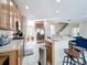 Spacious kitchen with bar seating, stainless steel appliances, and a seamless flow into the living area at 5009 Clover Mist Dr, Apollo Beach, FL 33572