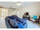Comfortable living room featuring a large sectional and modern entertainment center at 5009 Clover Mist Dr, Apollo Beach, FL 33572