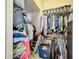 Walk-in closet with ample shelving and hanging space, offering plenty of room for storage at 5009 Clover Mist Dr, Apollo Beach, FL 33572
