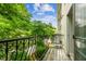 Relaxing balcony with black railings offering serene views at 609 S Glen Ave # E, Tampa, FL 33609